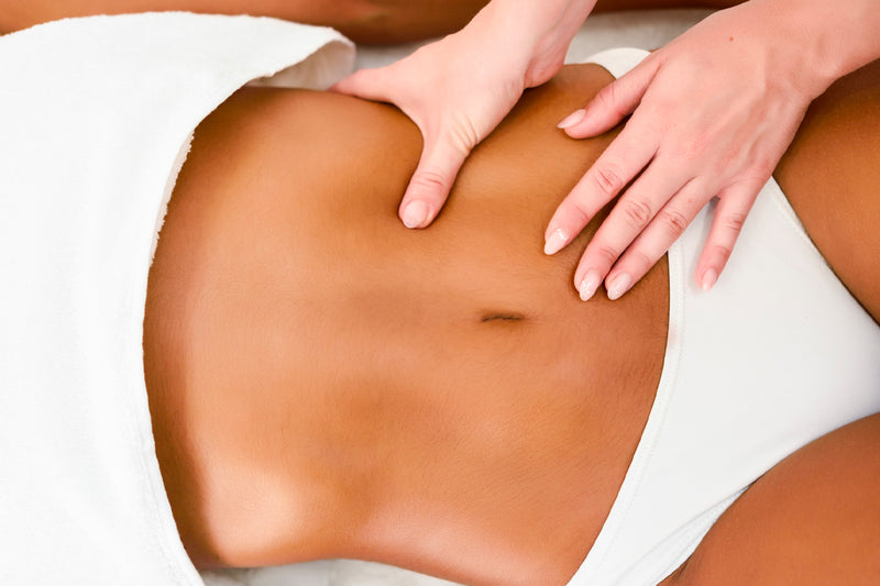 Woman receiving a lymphatic drainage massage to eliminate excess fluid